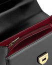 Sac THEA noir, vue intérieure sur doublure bordeaux, poche zippée et fermoir doré gravé