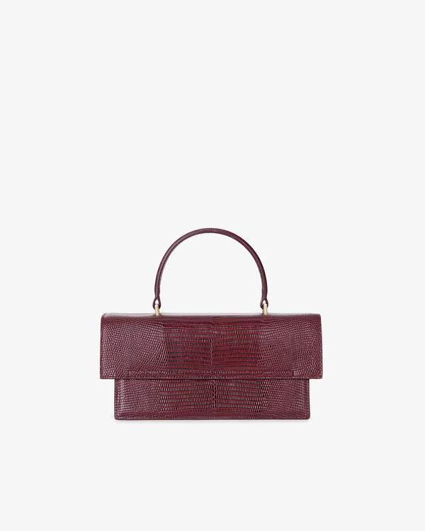 Sac THEA Bordeaux embossé lézard, vue de face, posé, avec poignée rigide
