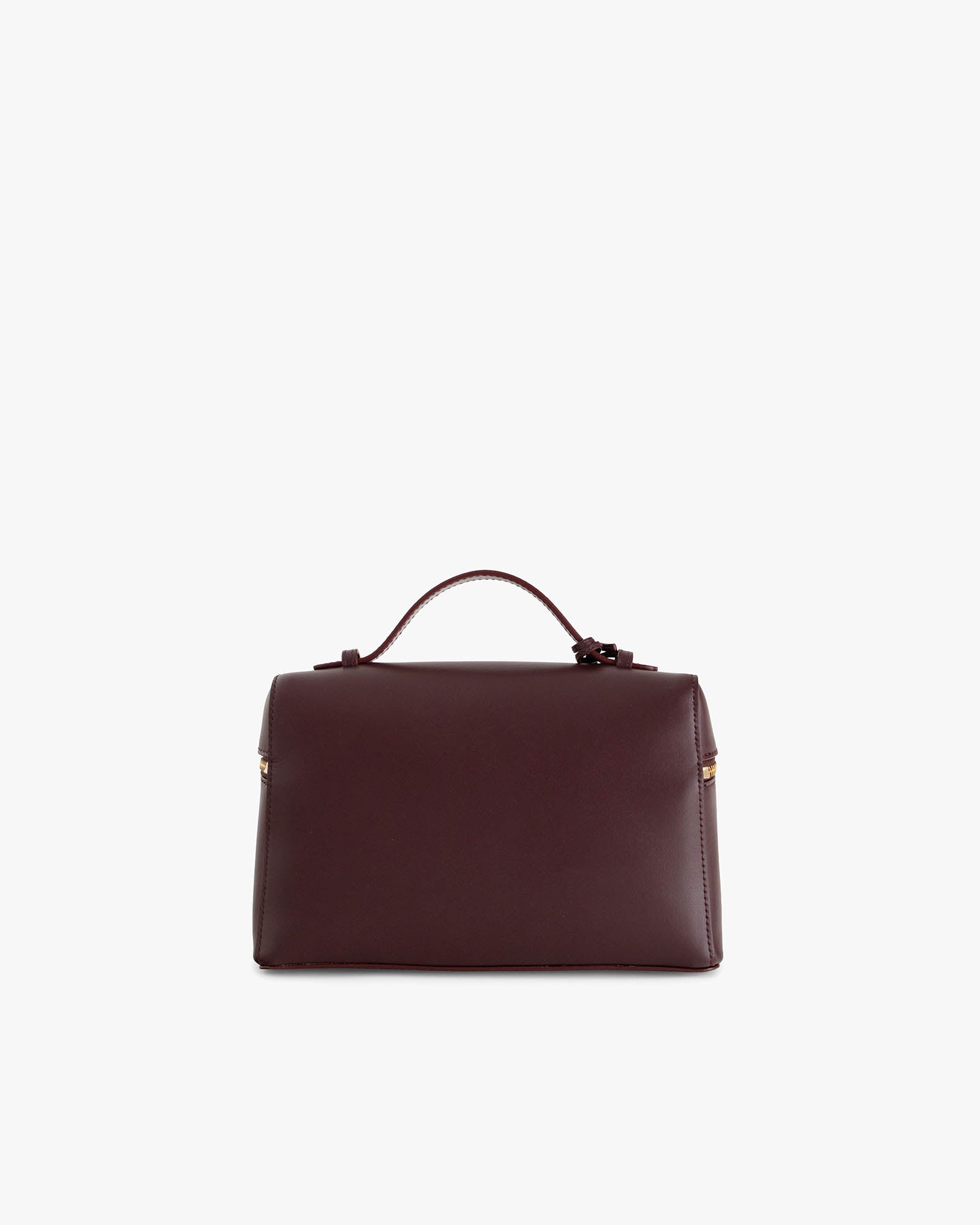 Sac VAYA Aubergine de dos, posé, avec anse portée à la main et détail Key Bell doré