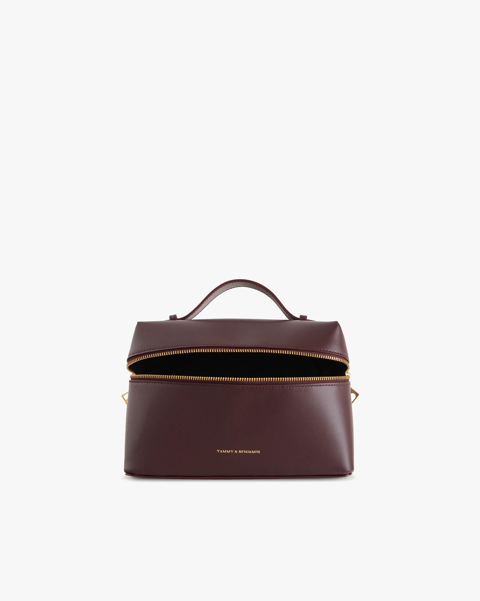 Sac VAYA Aubergine en cuir, vue de face ouvert, zip détaché montrant l'intérieur noir