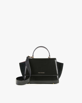 Sac ALEXIA noir, vue de face posé, poignée haute et bandoulière amovible attachée, ailes latérales visibles