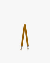 Short strap Marais in leather, laid flat, aged brass clasps at both ends