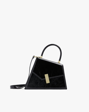 Sac CUBIST Noir naplak, vue de profil, poignée ronde et bandoulière fine ajustable, fermoir doré rectangulaire