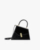 Sac CUBIST Noir naplak, vue de profil, poignée ronde et bandoulière fine ajustable, fermoir doré rectangulaire
