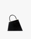 Sac CUBIST noir naplak, vue de trois quarts, poignée relevée, posé sur fond blanc