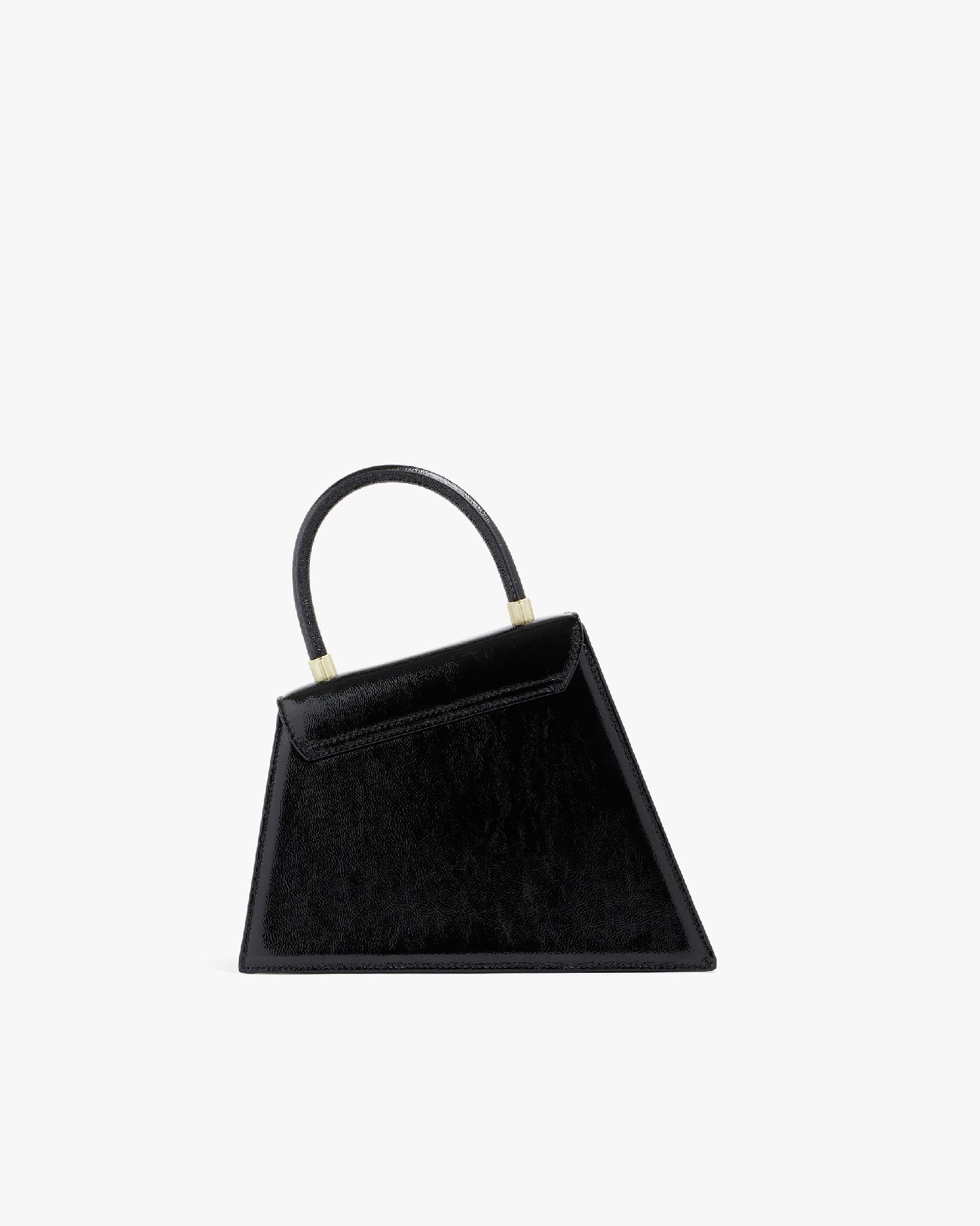 Sac CUBIST noir naplak, vue de trois quarts, poignée relevée, posé sur fond blanc