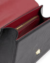 Sac CUBIST Noir naplak, vue intérieure ouverte, poche zippée et fermoir doré visibles