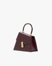 CUBIST bag in Mahogany, three-quarter view, handle up, gold clasp, standing