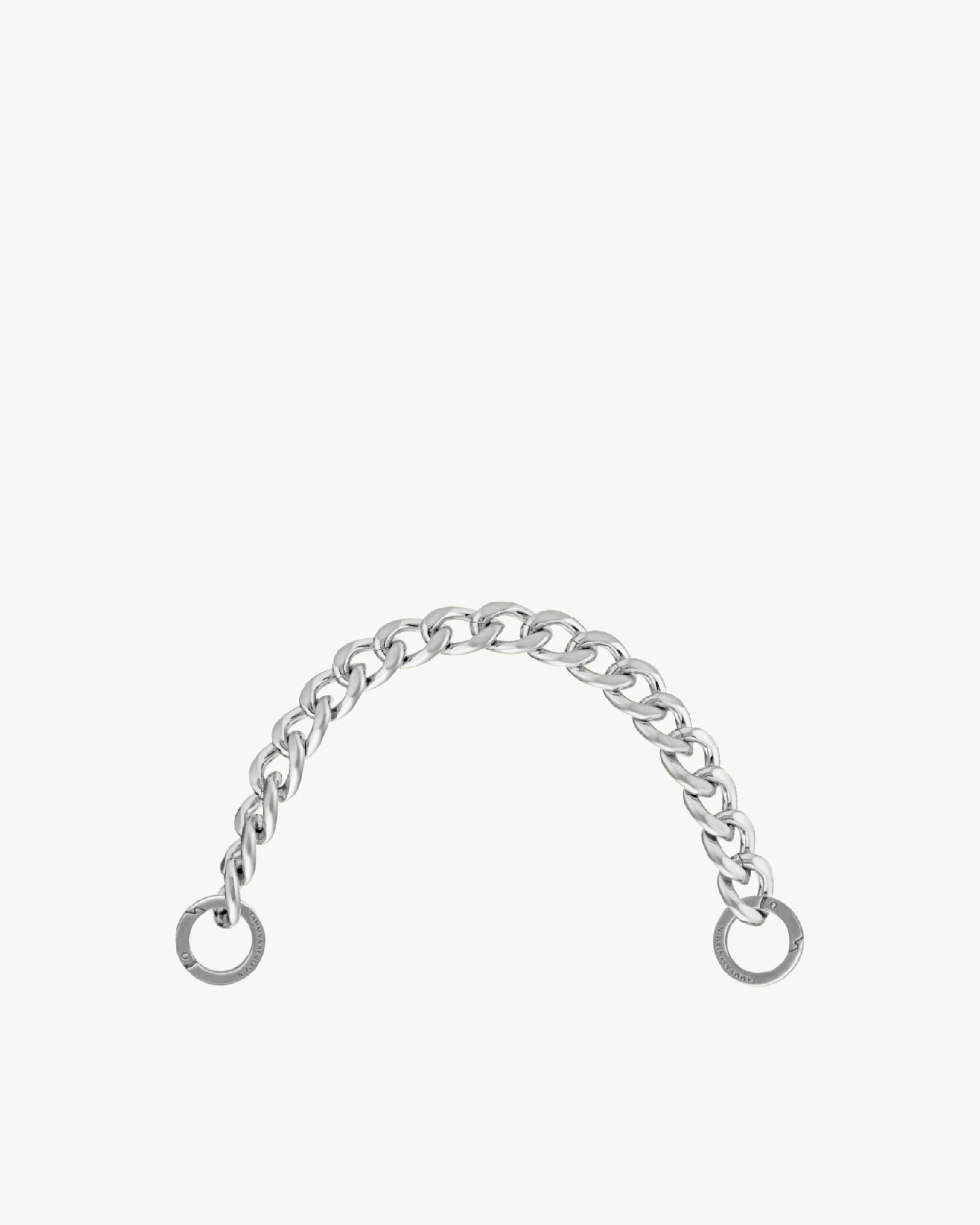 Short chain in silver metal, laid flat in an arch shape, with engraved rings at each end