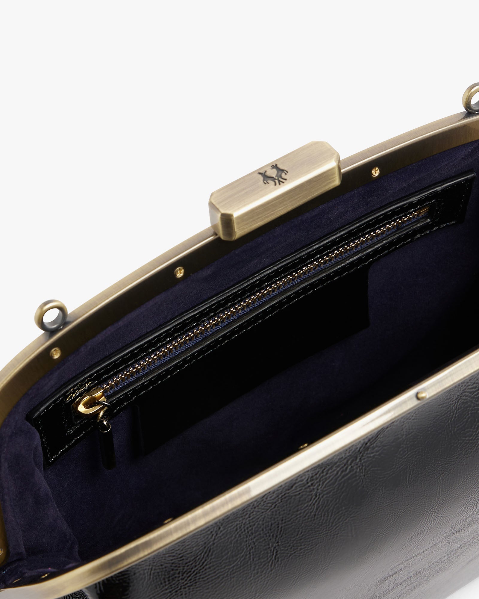 EMMA bag in black naplak, open interior view showing gold clasp and zip pocket