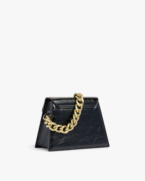 GABRIELLE bag in black patent naplak leather, three-quarter view with thick gold chain handle