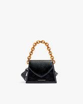 GABRIELLE bag in black naplak leather, front view with short tortoiseshell chain handle