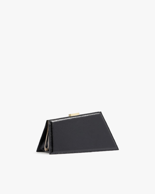 JAY bag in black naplak, side view, propped open, gold clasp visible, triangular silhouette