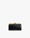 Sac JEANNE BAGUETTE noir, vue de face, posé, fermoir doré rétro fermé