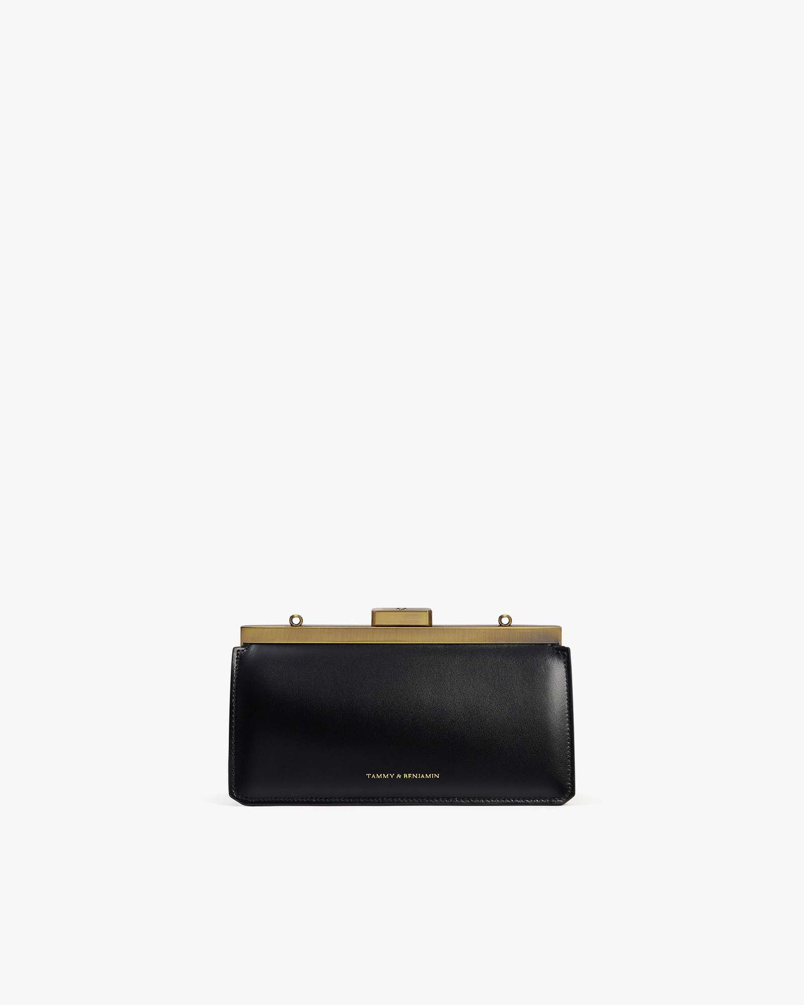 Sac JEANNE BAGUETTE noir, vue de face, posé, fermoir doré rétro fermé