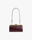 Sac JEANNE BAGUETTE Mahogany de face, anse longue portée, fermoir doré apparent