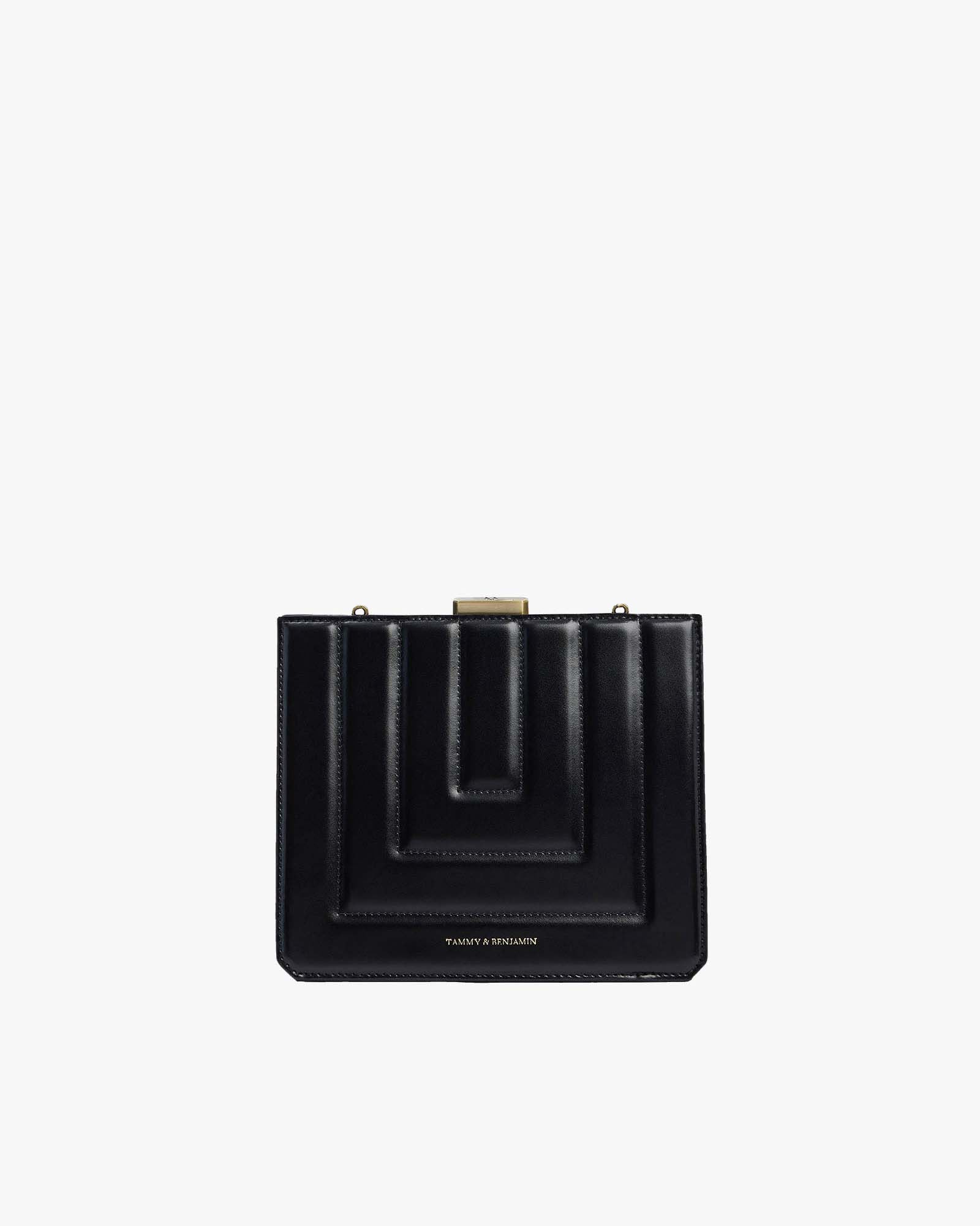 Sac JUDE noir matelassé, vue de face, fermoir doré et surpiqûres géométriques