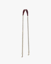 Chaîne longue Mahogany, épaulette en cuir et chaîne en laiton vieilli, posée à plat