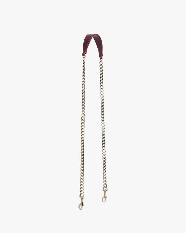 Chaîne longue Mahogany, épaulette en cuir et chaîne en laiton vieilli, posée à plat