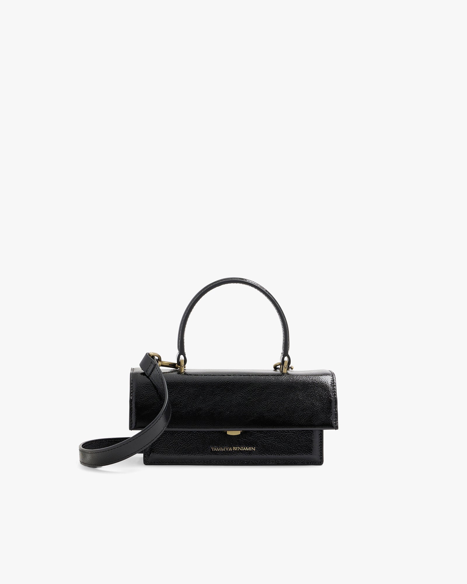 THEA MINI bag in black naplak, front view, standing, with top handle and detachable strap unclipped