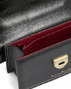THEA MINI bag in black naplak, flap open, close-up of red interior and gold clasp