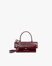 THEA MINI Bordeaux naplak, front view, top handle raised, detachable strap attached, flap closed