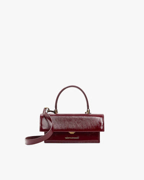 THEA MINI Bordeaux naplak, front view, top handle raised, detachable strap attached, flap closed