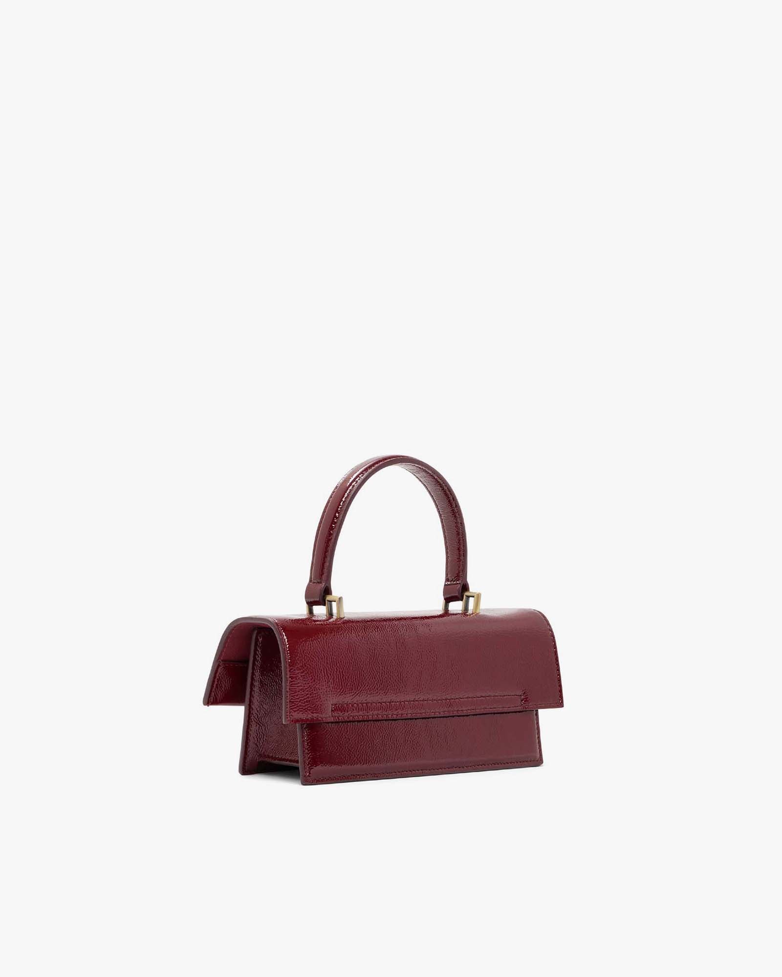 THEA MINI bag in burgundy naplak, back three-quarter view, standing, top handle raised