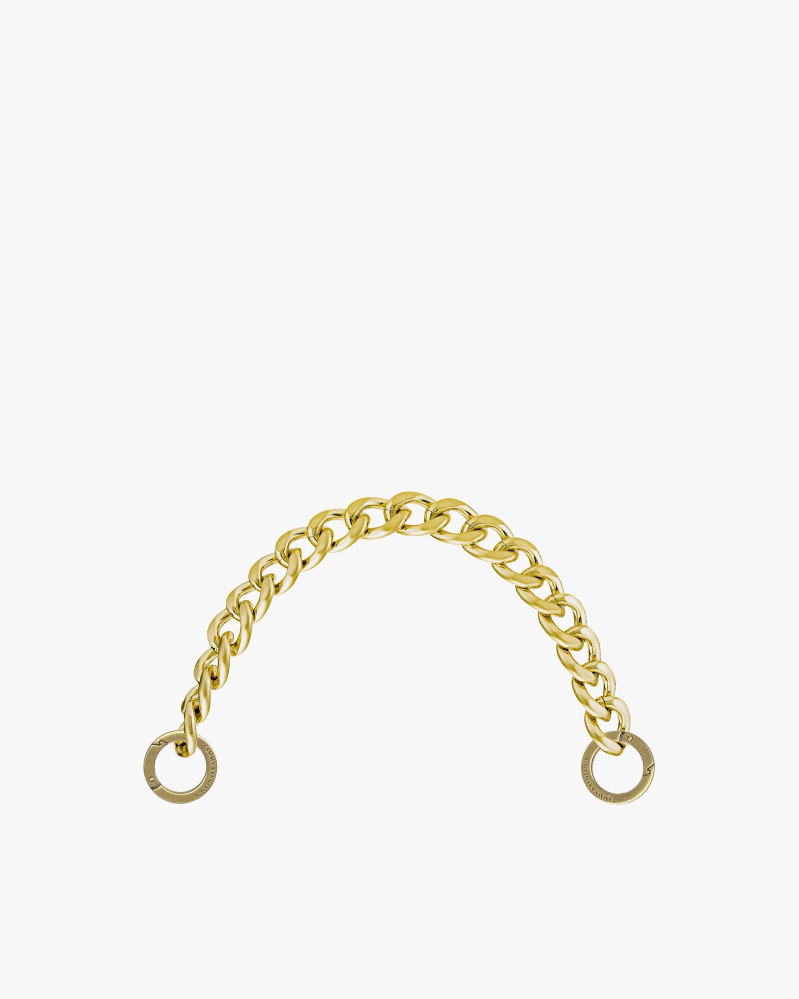 Short chain in gold-tone metal, laid in an arc, with its two engraved rings at each end