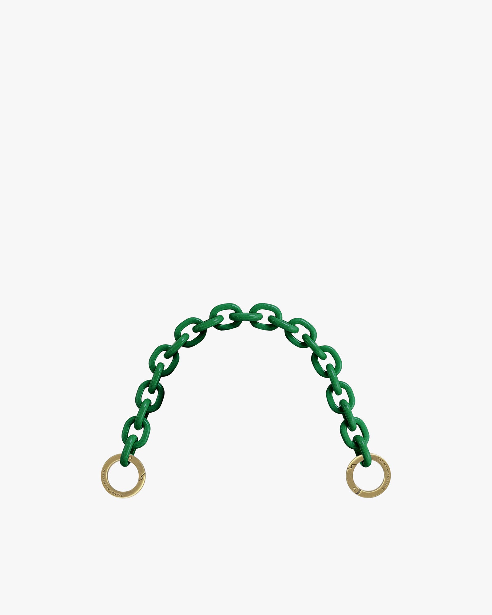 Short chain in emerald green resin, front view showing both engraved aged brass rings