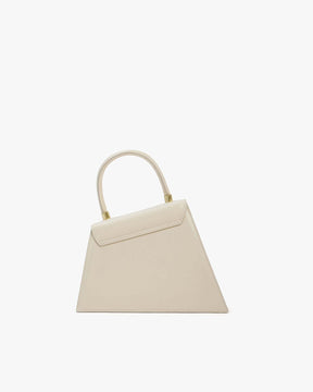 CUBIST bag in Ivoire, front view, standing, asymmetric trapeze shape with round handle