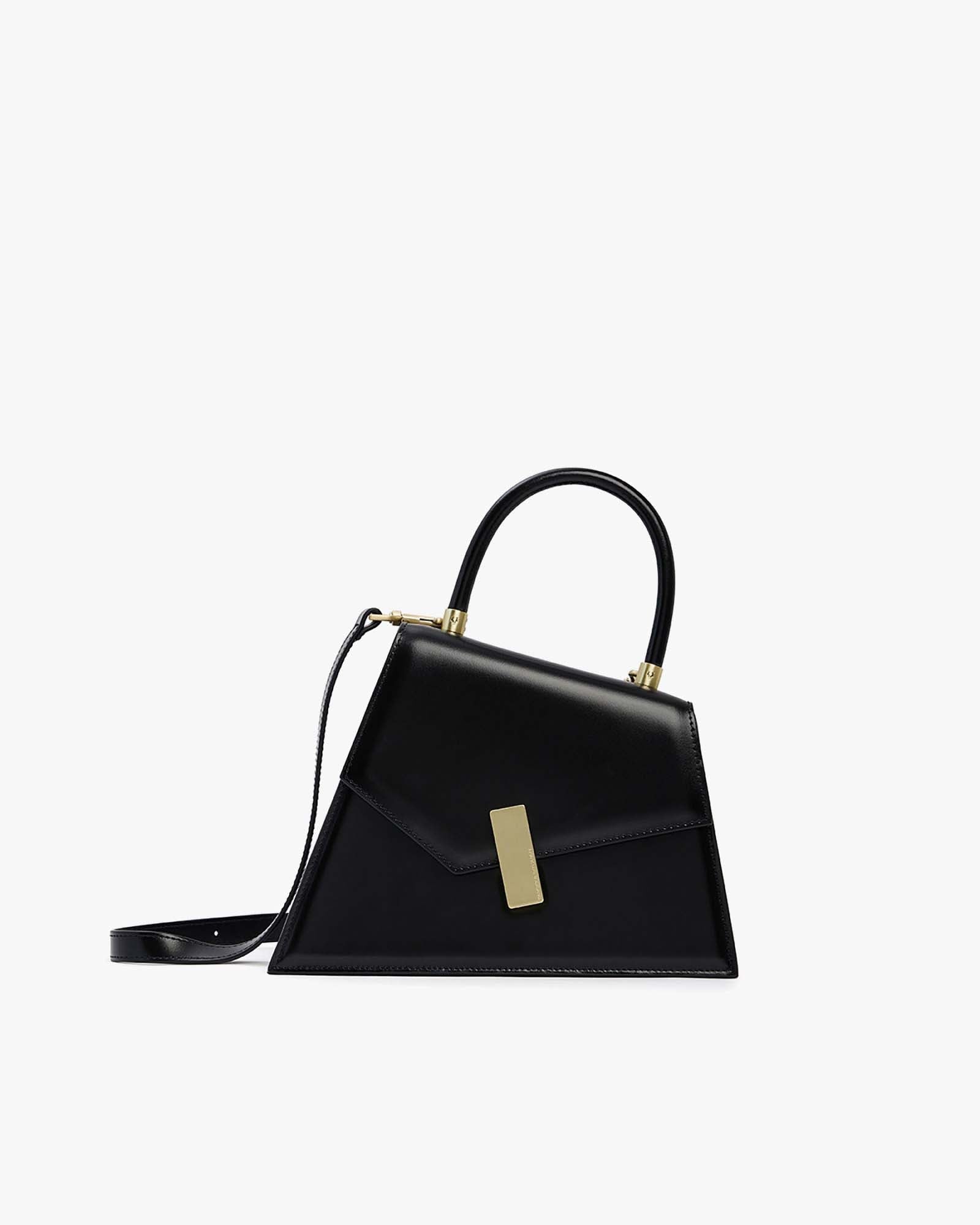 Sac CUBIST noir en cuir, vue de profil, poignée ronde relevée, fermoir doré et bandoulière fine