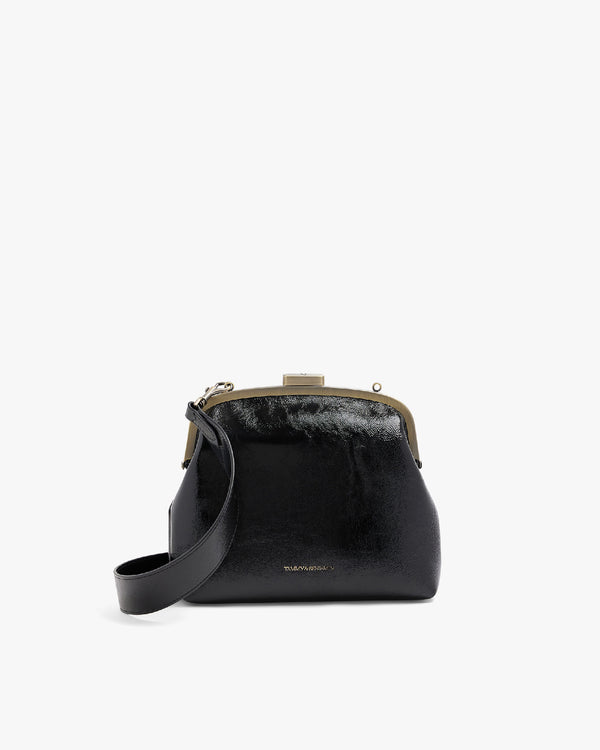 EMMA bag in black naplak, front three-quarter view, showing metal clasp frame and detachable shoulder strap