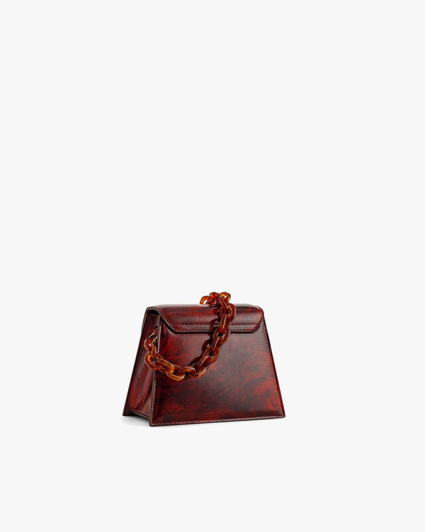 Sac GABRIELLE Marbre de trois quarts, anse chaîne effet écaille, silhouette trapèze