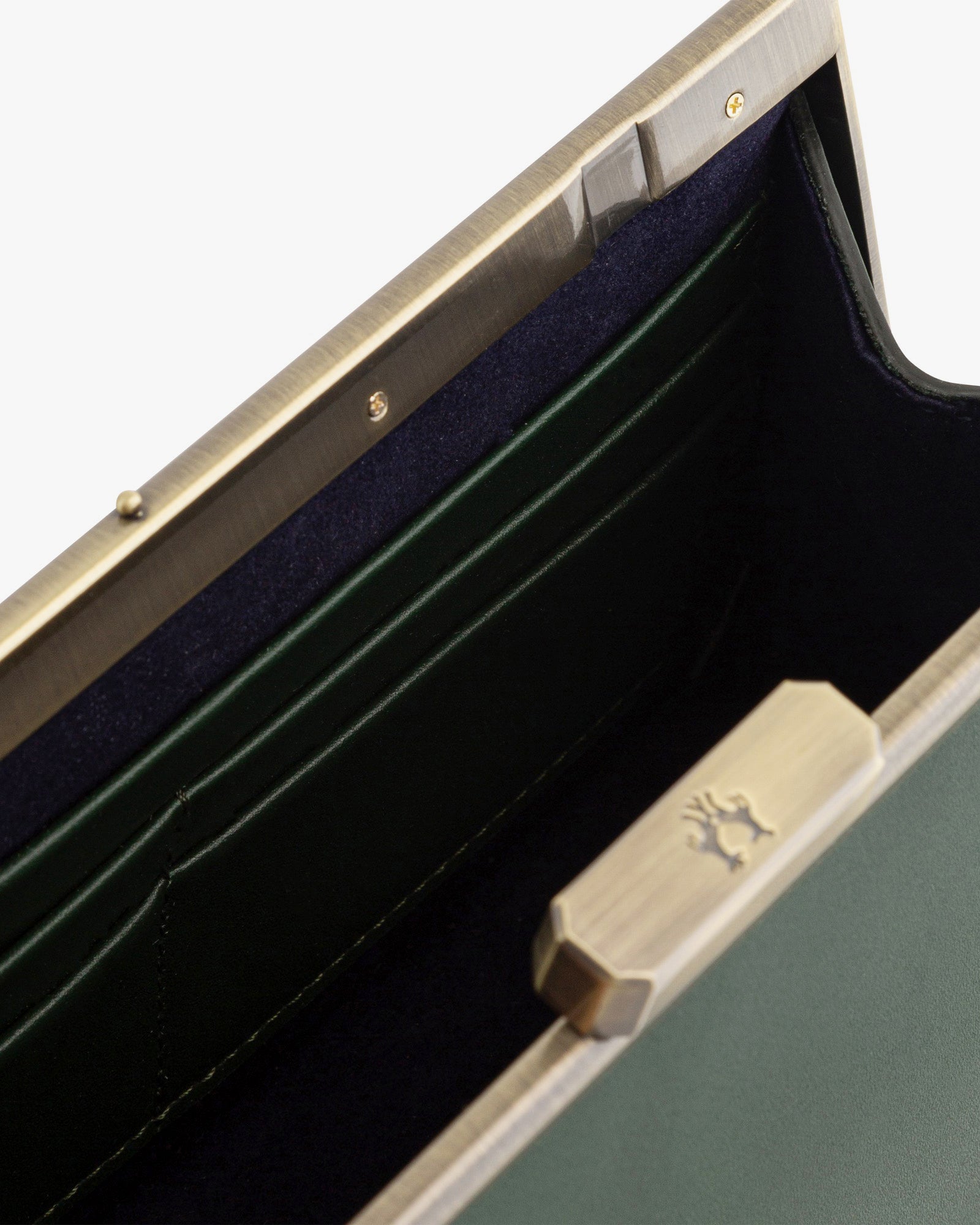JEANNE BAGUETTE bag in emerald green, open view showing retro clasp and navy interior