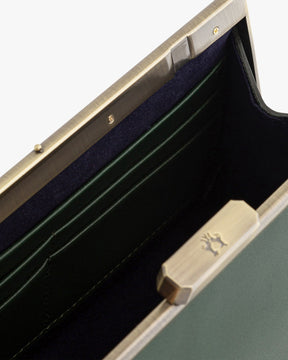 JEANNE BAGUETTE bag in emerald green, open view showing retro clasp and navy interior