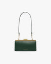 JEANNE BAGUETTE bag in emerald green, front view, standing, with long strap and gold clasp