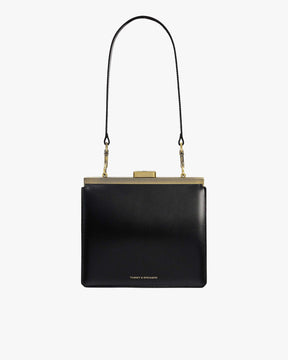 Sac JEANNE en cuir noir, vue de face avec fermoir métallique doré et anse bandoulière détachable
